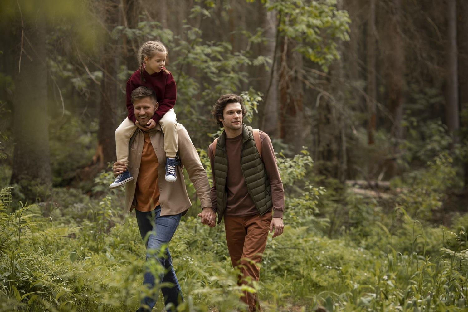 Girl with her dads enjoying family trip